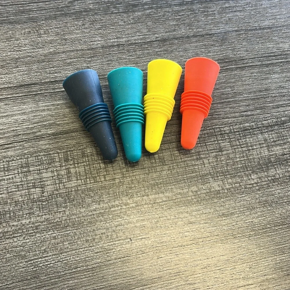 Set of 4 Colorful Houdini Silicone wine stoppers.